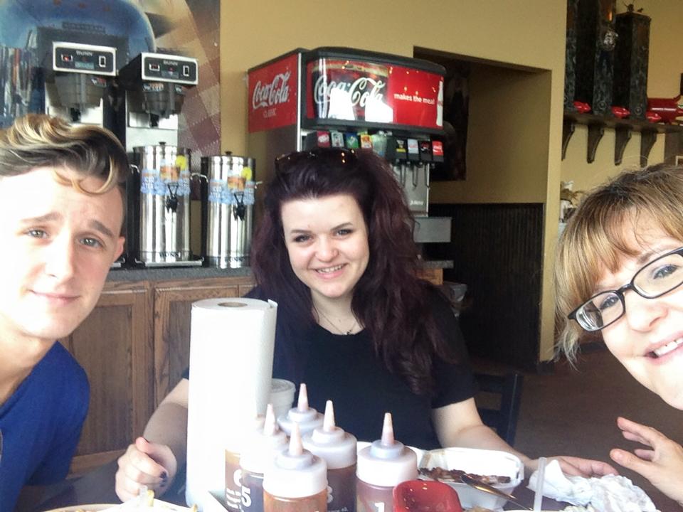 Jo, her brother, and her mother at a fast food restaurant