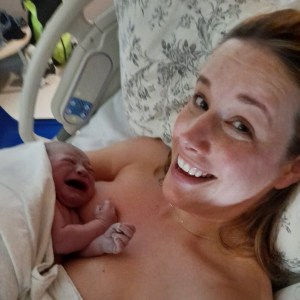 The author with a newborn baby on her chest.