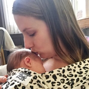 The author kissing her baby.